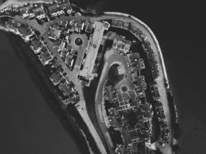 grayscale aerial photography of city islet