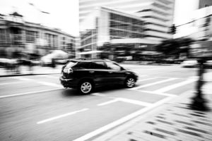 grayscale photography of SUV on road